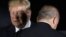 JAPAN -- U.S. President Donald Trump walks past Turkey's president Recep Tayyip Erdogan as they pose for a group photo during the G20 Summit in Osaka, June 27, 2019