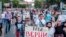 RUSSIA -- People hold posters that read: "We Trust Sergei Furgal", during an unsanctioned protest in support of Sergei Furgal, the governor of the Khabarovsk region, in Khabarovsk, July 21, 2020