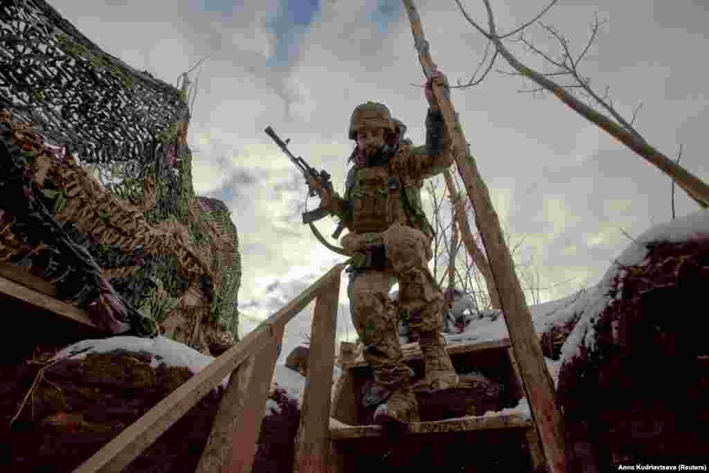 A Ukrainian serviceman descends steps at a frontline position facing Russia-backed separatists in the Donetsk region on January 22.
