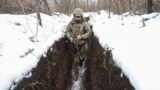UKRAINE RUSSIA CRISIS -- A Ukrainian serviceman checks the situation at the positions on a front line, not far from pro-Russian militants controlled city of Horlivka, Ukraine, 31 January 2022 amid escalation on the Ukraine-Russia border. Ukrainian Foreign