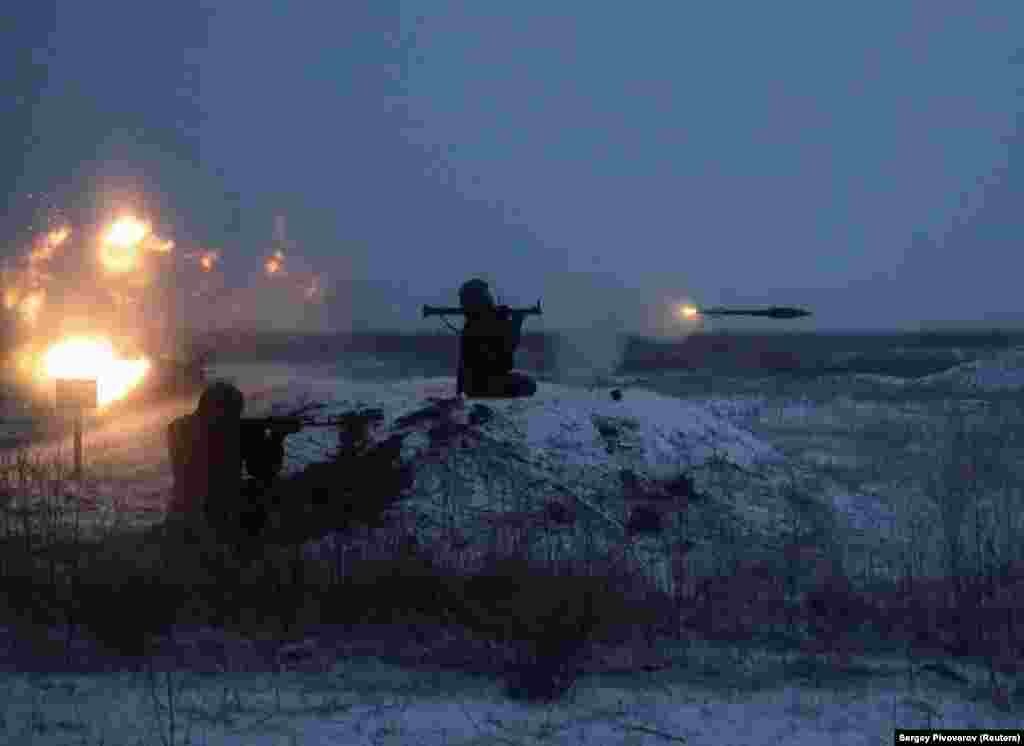 A Russian soldier fires a rocket-propelled grenade during drills at the Kuzminsky range in the southern Rostov region of Russia on January 21. The military firing range is around 50 kilometers from the border with Ukraine. Russia has massed more than 125,000 troops near the border with Ukraine.
