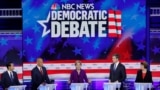 Miami, Florida, U.S. - U.S. Senator Elizabeth Warren speaks as former HUD Secretary Julian Castro, U.S. Senator Cory Booker, former U.S. Rep. Beto O'Rourke and Senator Amy Klobuchar listen during the first U.S. 2020 presidential election Democratic candid