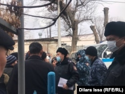 People look for their detained relatives at a detention center in the southern Kazakh city of Shymkent, near the border with Uzbekistan, on January 10, 2022.
