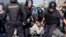 RUSSIA – Policemen detain opposition supporters during a protest