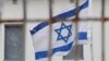 В Москве у посольства Израиля задержали пикетчицу с плакатом против терроризма. Ее обвинили в "дискредитации" российской армии