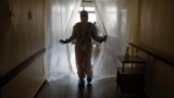 UKRAINE -- A doctor walks along a corridor while entering a hospital for patients infected with the coronavirus disease (COVID-19) in Kyiv, November 25, 2020