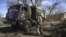 UKRAINE – Ukranian troops drive a captured Russian military vehicle after retaken the village of Mala Rogan, East of Kharkiv, on March 28, 2022