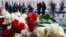 RUSSIA -- People lay flowers to mark the first anniversary of the blast that authorities say was a suicide bombing killed 16 people on a subway car in St. Petersburg, April 3, 2018