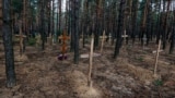 UKRAINE – A mass burial of the dead soldiers of the Armed Forces of Ukraine near Izyum, Ukraine, Sept. 15, 2022
