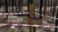 UKRAINE – A mass burial of the dead soldiers of the Armed Forces of Ukraine near Izyum, Ukraine, Sept. 15, 2022
