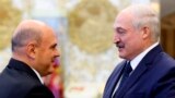 BELARUS -- Russian Prime Minister Mikhail Mishustin, left, shakes hands with Belarusian President Alyaksandr Lukashenka prior to their talks in Minsk, Belarus, Thursday, September 3, 2020