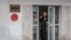 RUSSIA -- A security stands on the enter of the building of Russian newspaper 'Novaya Gazeta' in Moscow, March 15, 2021