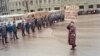 SOVIET UNION -- LITHUANIA -- (FILES) A woman demonstrates in Moscow on January 13, 1991 protesting against the Soviet army crackdown against the nationalist Lithuanian authorities. Demonstrators are passing by the KGB building (aka Lubyanka). Lithuania wa