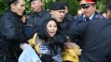 Kazakhstan - Kazakh police officers detain opposition protesters in Almaty on May 1, 2019. - Dozens of protesters opposed to Kazakhstan's authoritarian regime were arrested by police in the largest city Almaty on Wednesday after decrying a snap election c