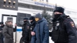 RUSSIA -- Police officers detain a woman, participant of a forum of independent members of municipal councils in Moscow, March 13, 2021