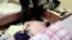 BELARUS -- A Belarusian KGB officer detains a Russian man in a sanitarium outside in Minsk, July 29, 2020