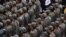 Revolutionary Guard Corps cadets attend the funeral of Razi Moussavi, a senior commander in the Quds Force of Iran's Islamic Revolutionary Guard Corps (IRGC) who was killed on December 25 in an Israeli strike in Syria, in Tehran, on December 28, 2023. (Ph