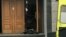 RUSSIA -- A man who set off a bomb at the FSB office lies on the ground at the entrance, in the city of Arkhangelsk in northern Russia, Wednesday, Oct. 31, 2018.