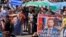 Citizens hold a placard "Give Us Back Furgal" during a rally in support of Khabarovsk Governor 