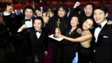 Best Picture Award winners for "Parasite" pose onstage during the 92nd Annual Academy Awards