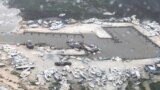 Америка: последствия "Дориана" на Багамах и Walmart против оружия