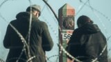 Poland - Migrants are seen on the Belarus side of the border with Poland near Kuznica, 9nov2021