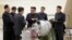 North Korean leader Kim Jong Un provides guidance with Ri Hong Sop (3rd L) and Hong Sung Mu (L) on a nuclear weapons program