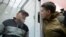 UKRAINE – Member of Ukrainian parliament Nadia Savchenko (R) speaks with Volodymyr Ruban, head of Officer Corps centre, dealing with prisoners of war exchange in eastern Ukraine, as they attend a court hearing in Kyiv, March 9, 2018