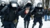 RUSSIA – Police detain a man during a protest against the jailing of opposition leader Alexei Navalny in People gather in St.Petersburg, Jan. 23, 2021