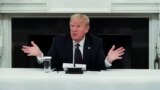 U.S. -- U.S. President Donald Trump talks about taking daily doses of hydroxychloroquine pills during a coronavirus disease pandemic meeting with restaurant executives and industry leaders in the State Dining Room at the White House in Washington, May 18,