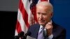 U.S. -- U.S. President Joe Biden holds his face mask as he speaks during an event to commemorate the 50 millionth COVID-19 shot, in the South Court Auditorium on the White House campus, in Washington, February 25, 2021