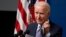 U.S. -- U.S. President Joe Biden holds his face mask as he speaks during an event to commemorate the 50 millionth COVID-19 shot, in the South Court Auditorium on the White House campus, in Washington, February 25, 2021