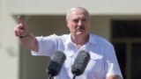 BELARUS -- Belarusian President Alyaksandr Lukashenka gestures as he delivers a speech during a rally of his supporters near the Government House on Independence Square in Minsk, August 16, 2020
