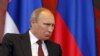Serbia -- Russian President Vladimir Putin reacts during a meeting with his Serbian counterpart at Serbia Palace building in Belgrade, October 16, 2014