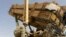 In this US Army handout photo released on June 1, 2026, a US Army air defence artilleryman conducts maintenance on an MIM-104 Patriot missile system, the army's primary terminal-phase anti-ballistic missile system, at an undisclosed location in the Middle