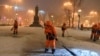 RUSSIA – MOSCOW, NOVEMBER 27, 2018: Street cleaners sweeping snow in Tverskoi Boulevard.