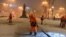 RUSSIA – MOSCOW, NOVEMBER 27, 2018: Street cleaners sweeping snow in Tverskoi Boulevard.