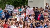 RUSSIA -- People hold posters during an unsanctioned protest in support of Sergei Furgal, the governor of the Khabarovsk region, who was interrogated ordered held in jail for two months, in Khabarovsk, July 11, 2020