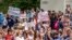 RUSSIA -- People hold posters during an unsanctioned protest in support of Sergei Furgal, the governor of the Khabarovsk region, who was interrogated ordered held in jail for two months, in Khabarovsk, July 11, 2020
