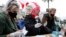 Belarus -- Activists wearing protective masks and gloves gather signatures in support of their potential candidates 