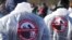 Russia -- People in protective suits take part in a protest demanding the closure of the Yadrovo solid waste landfill in Volokolamsk on March 24, 2018