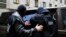 The Internal Security Agency (ABW) officers escort a man arrested on suspicion of spying