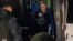 RUSSIA -- Police officers detain Russian opposition activist Aleksei Navalny as he leaves a detention center after a month in jail for an unsanctioned protest rally, in Moscow, September 24, 2018