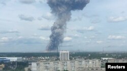 A still image, taken from video footage, shows smoke rising from the site of blasts at an explosives plant in the town of Dzerzhinsk.