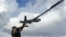 Ukrainian serviceman launches a reconnaissance drone near the frontline town of Pokrovsk