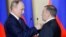 UKRAINE -- Russian President Vladimir Putin decorates businessman Arkady Rotenberg with the Hero of Labor medal during a ceremony to award constructors of the Crimean Bridge over the Kerch Strait in Sevastopol, Crimea, March 18, 2020