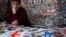 RUSSIA -- A photo shows shows a vendor with a newspaper featuring on the front page, an image of Russian President Vladimir Putin after his re-election at a newstand in Moscow, March 19, 2018