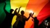 Serbia -- People take part in the Gay Pride parade under a huge rainbow flag, in Belgrade, September 18, 2016