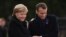FRANCE -- German Chancellor Angela Merkel (Left) and French President Emmanuel Macron embrace as they take part in a French-German ceremony in the clearing of Rethondes (the Glade of the Armistice) in Compiegne, northern France, on November 10, 2018, as p