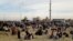EGYPT ATTACK -- Nov 24 -- A grab image taken from taken from a video footage shows people gathering outside the mosque that was attacked in the northern city of Arish, Sinai Peninsula, Egypt, 24 November 2017. 